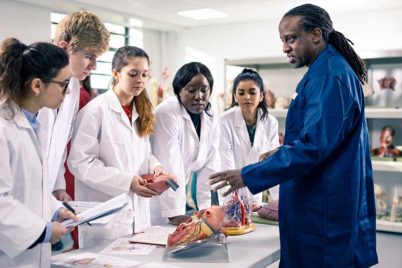 Medical students in an anatomy session with Professor Peter Bazira