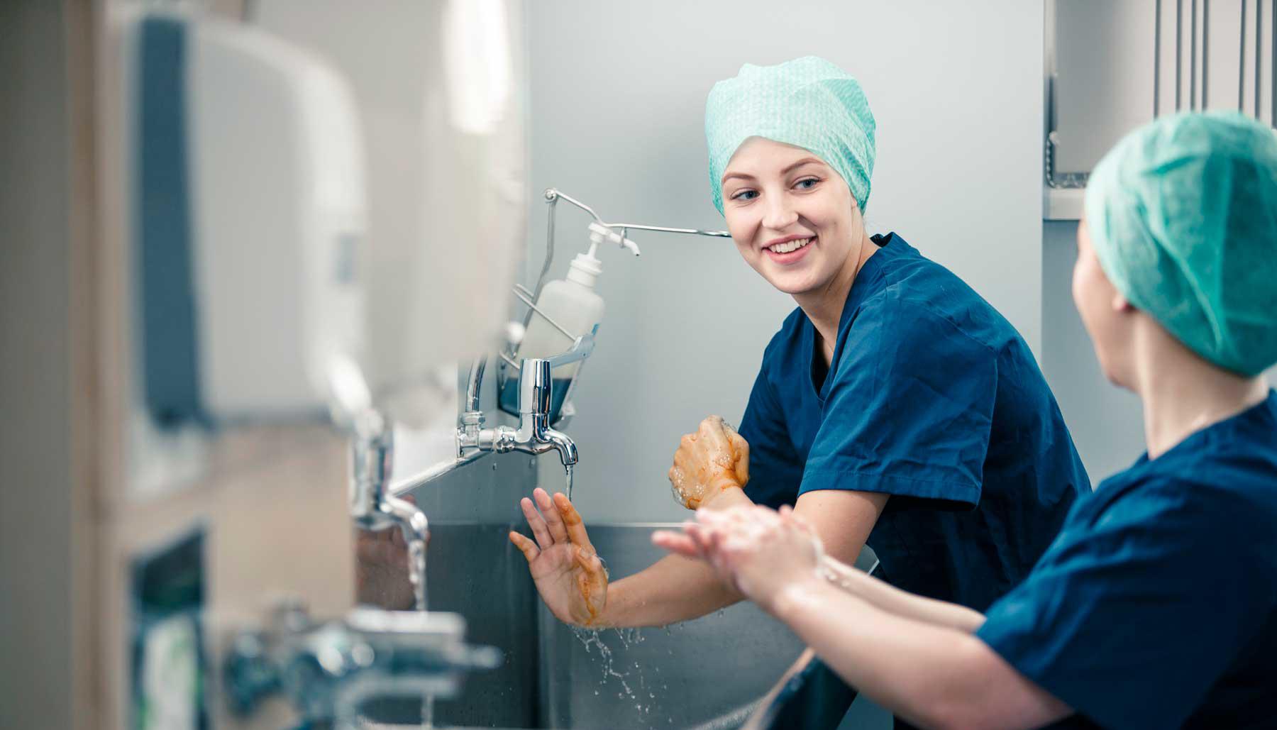 Medical students scrubbing up