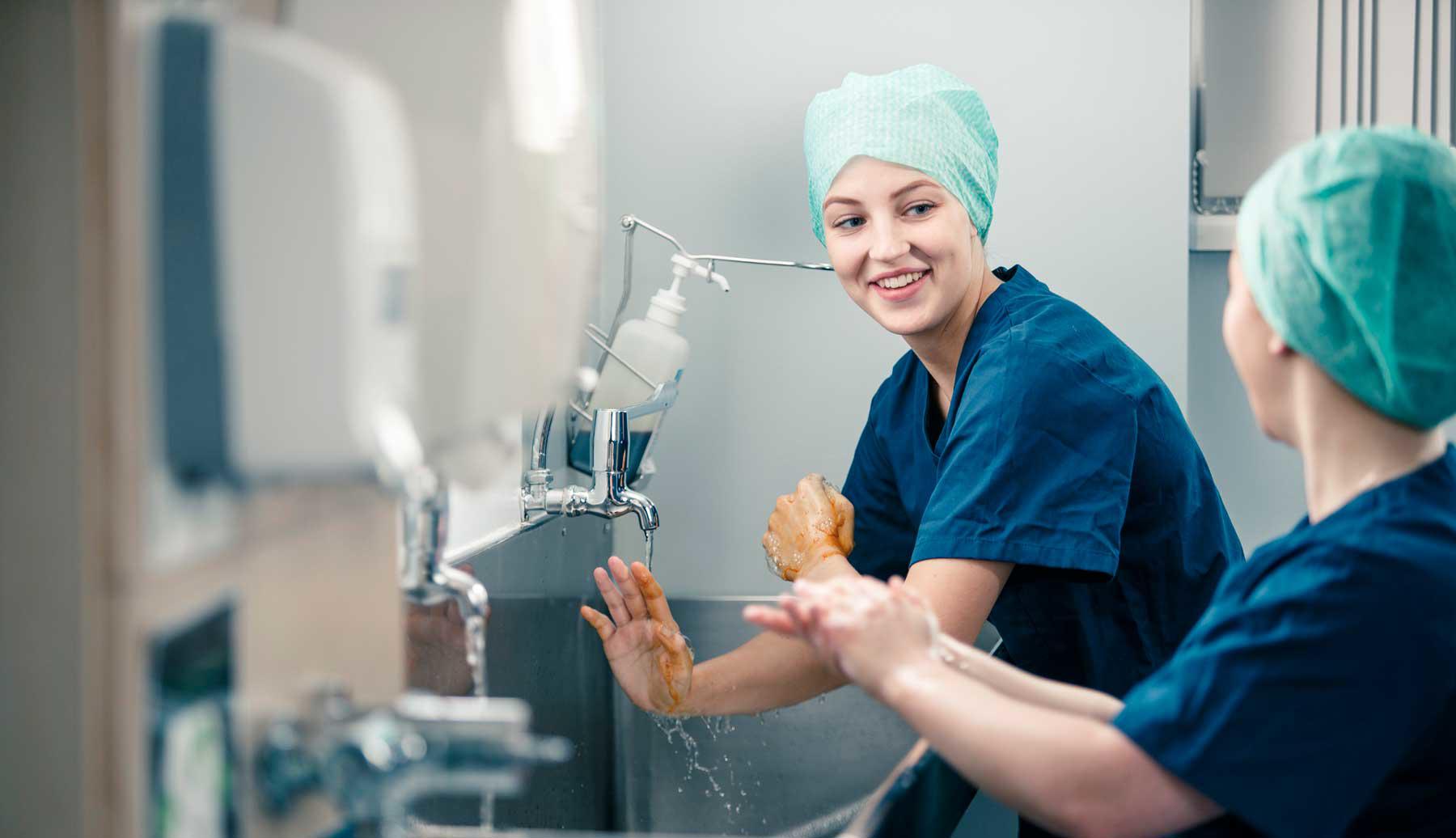 Medical students scrubbing up