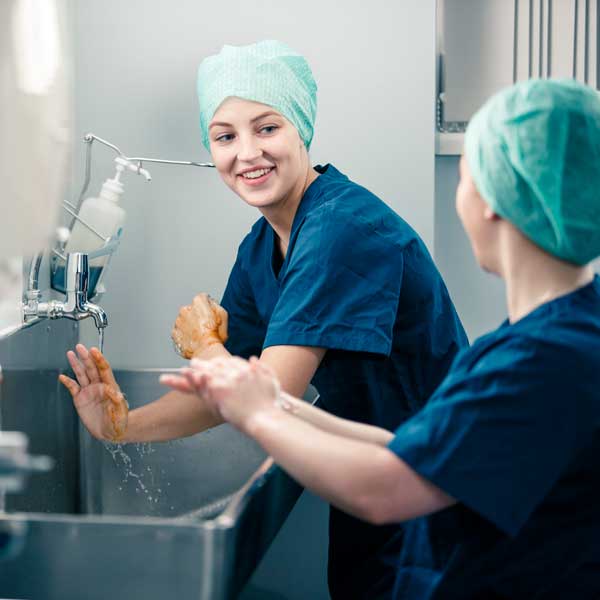 Medical students practising scrubbing up