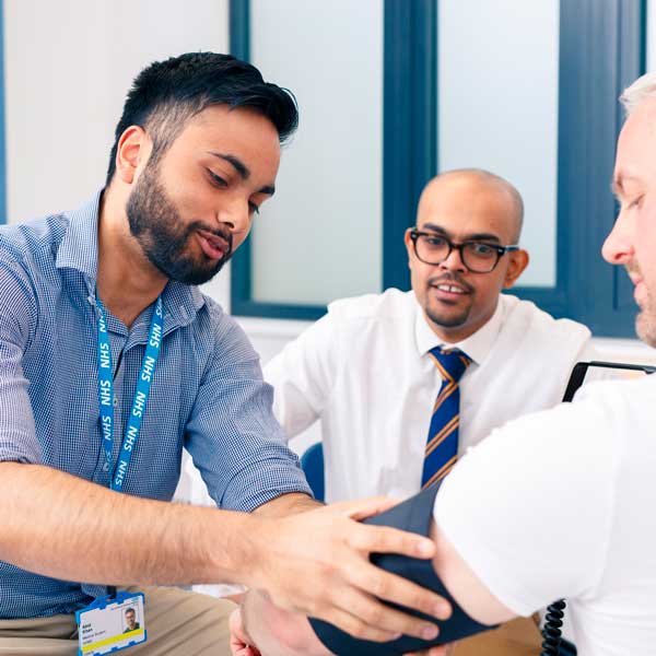 Medicine student and a GP with a patient at Brough GP Surgery