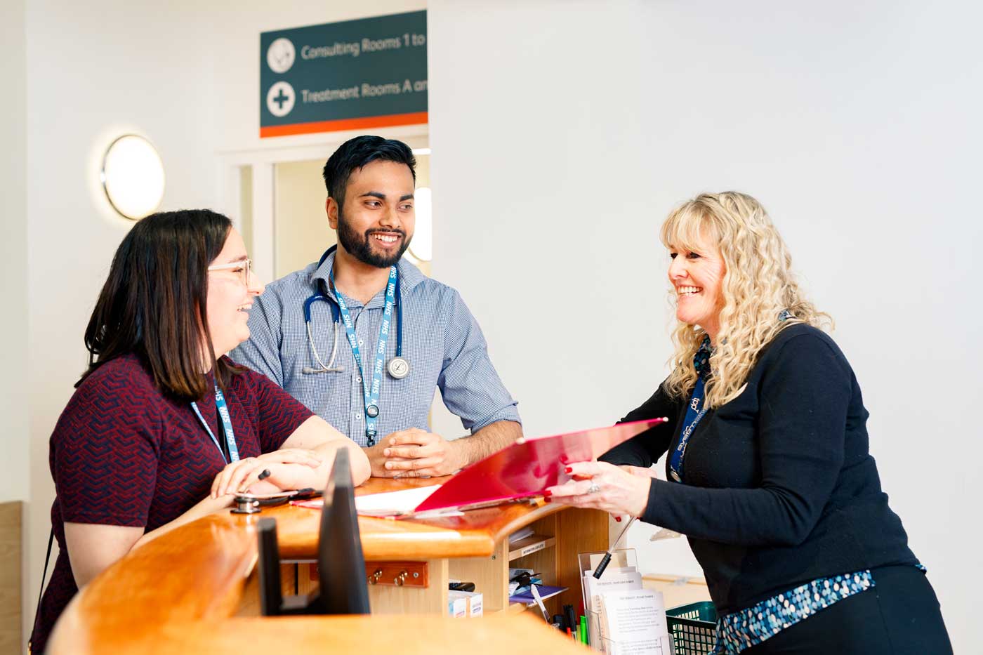 Medical students in discussion with a colleague at Brough GP Surgery