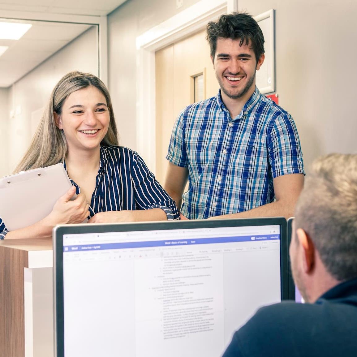 Students chatting to a member of the Student Liaison Team at Hull Royal Infirmary