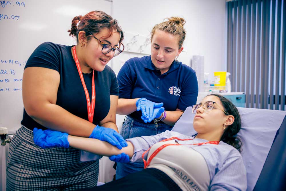 Pathways to Medicine students and Medicine student ambassadors undertaking clinical skills