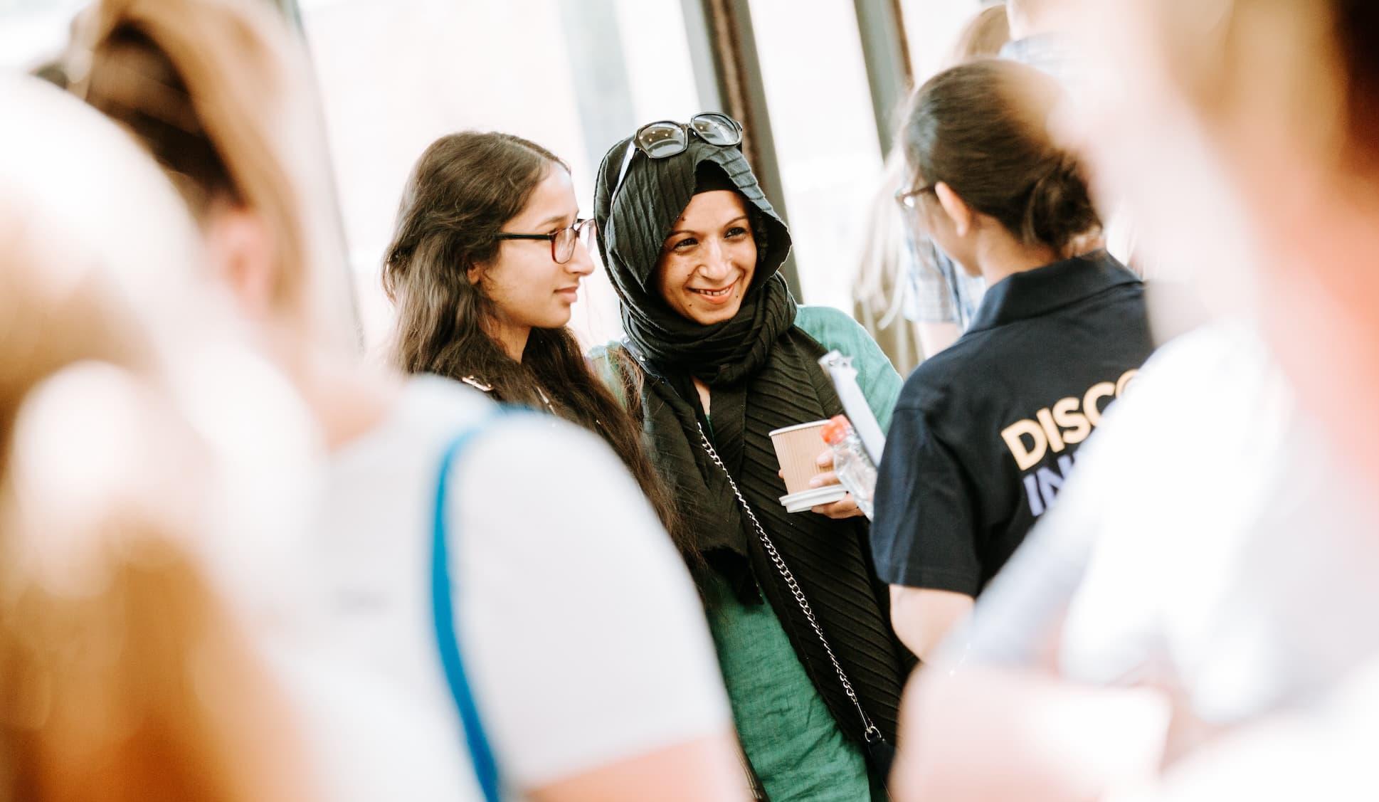 Visitors talking with a Medicine student ambassador