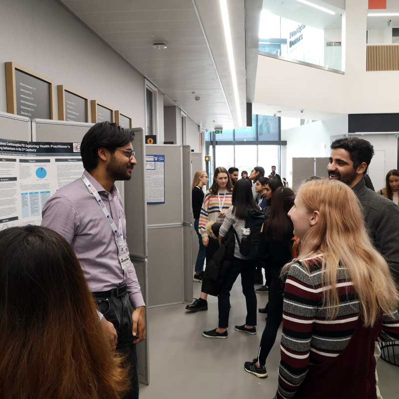 Medicine students and their poster presentations