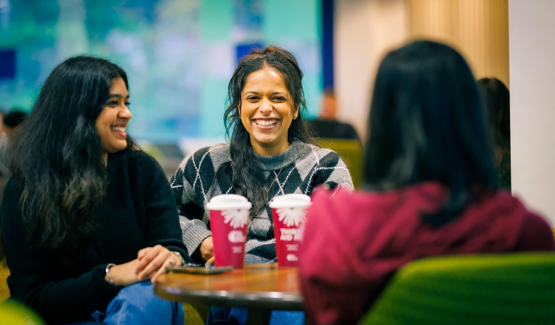 Students chatting over coffee on the Hull campus