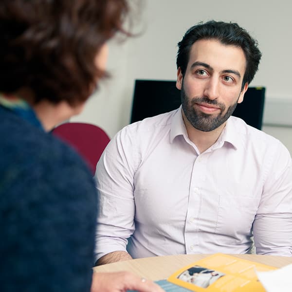 Member of staff offering support to student
