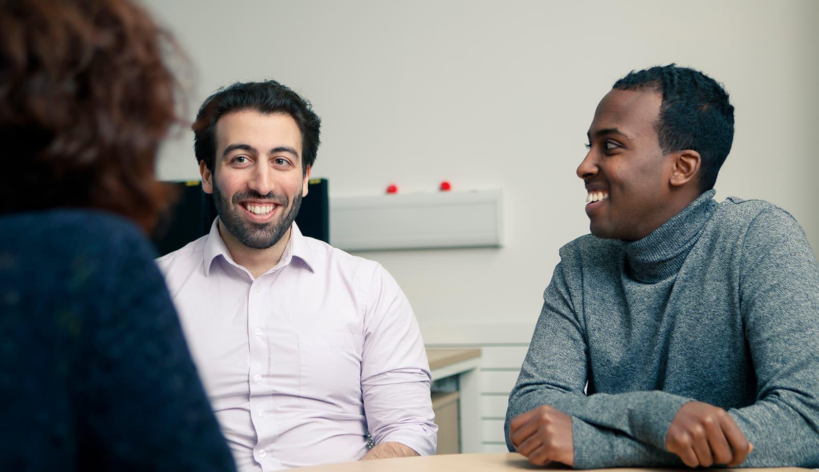 Students talking to a member of the Student Support Team