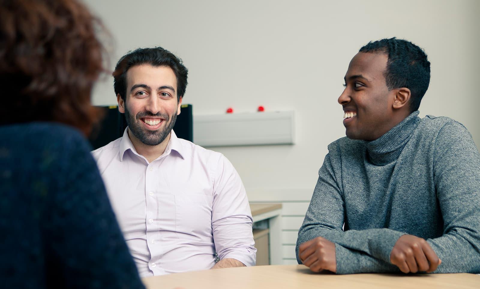 Students talking to a member of the Student Support Team