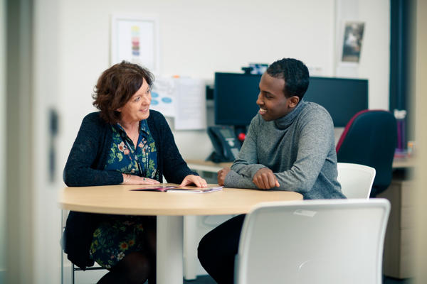 Student talking to a member of the Student Support Team