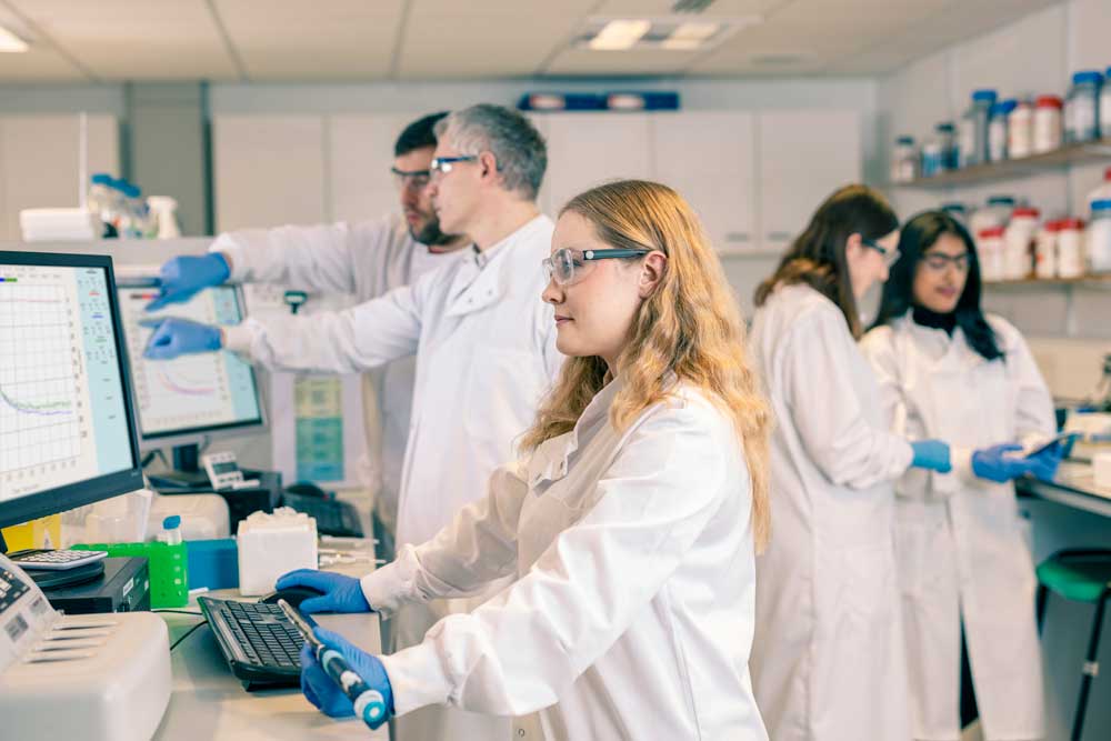 Pharmacology students and staff working in the lab