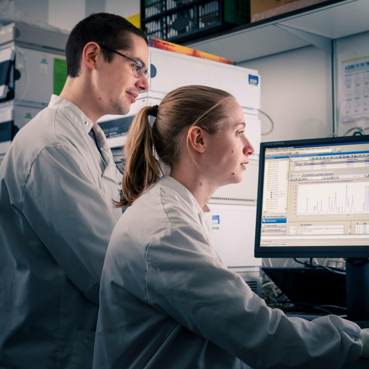 Pharmacology students working on a computer in a lab