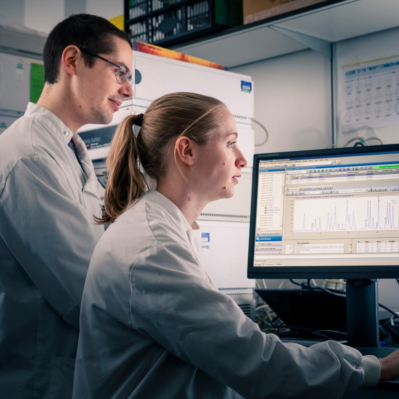 Pharmacology students working on a computer in a lab