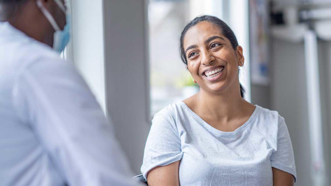 Patient smiling with a doctor