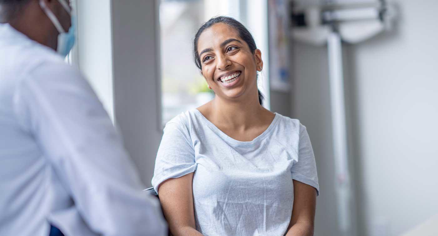 Patient smiling with a doctor