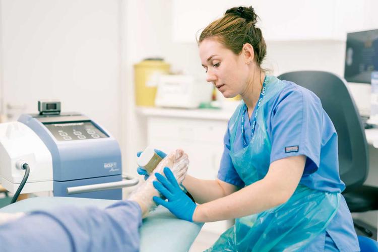 Ms Louise Hitchman, Vascular Registrar applying shockwave therapy on a diabetic foot ulcer