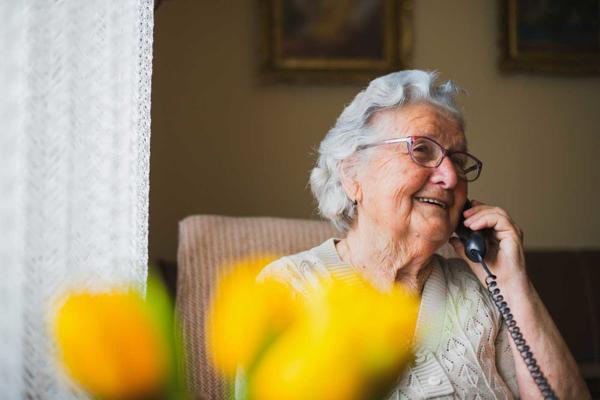 Elderly woman talking on the phone