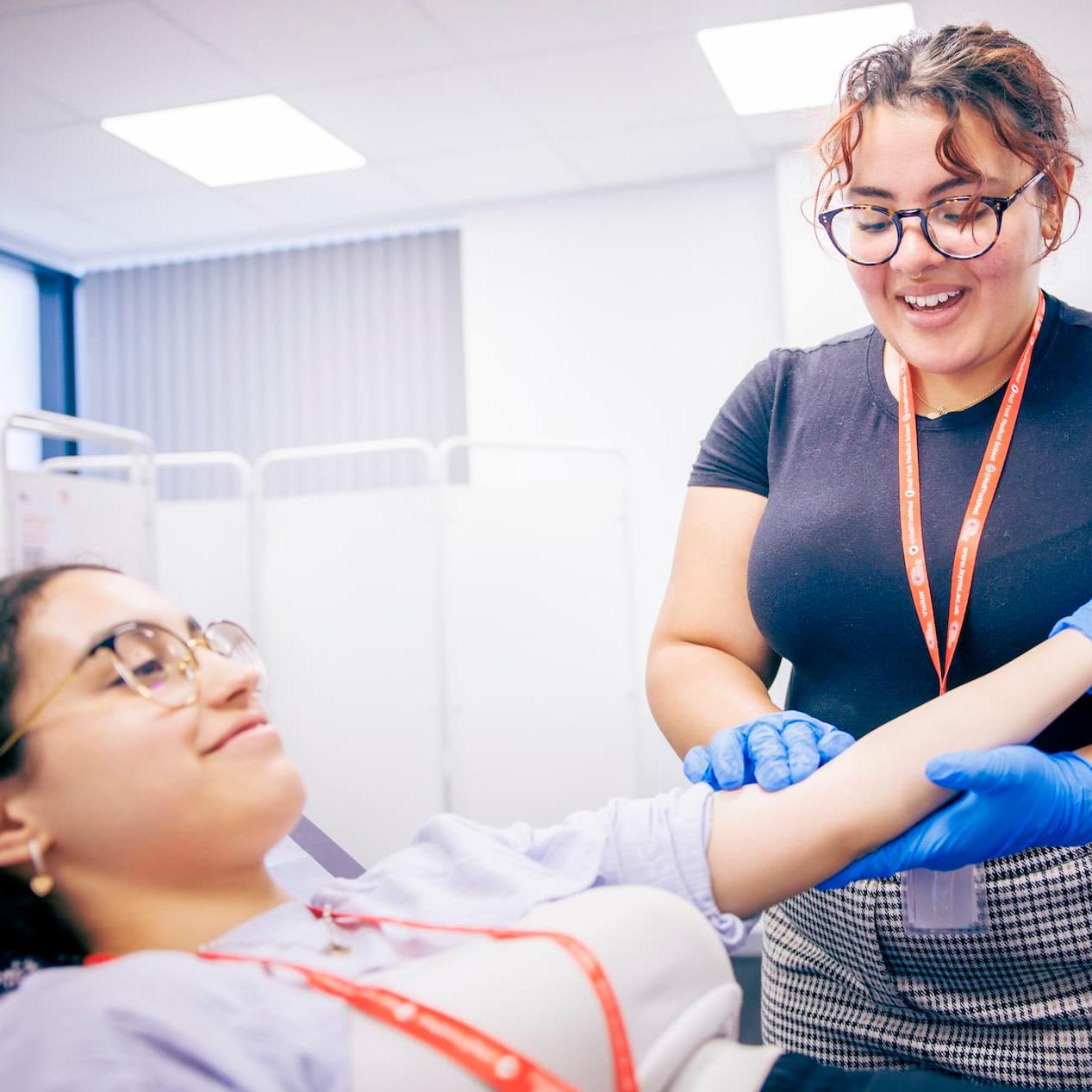 College students take part in a clinical skills session