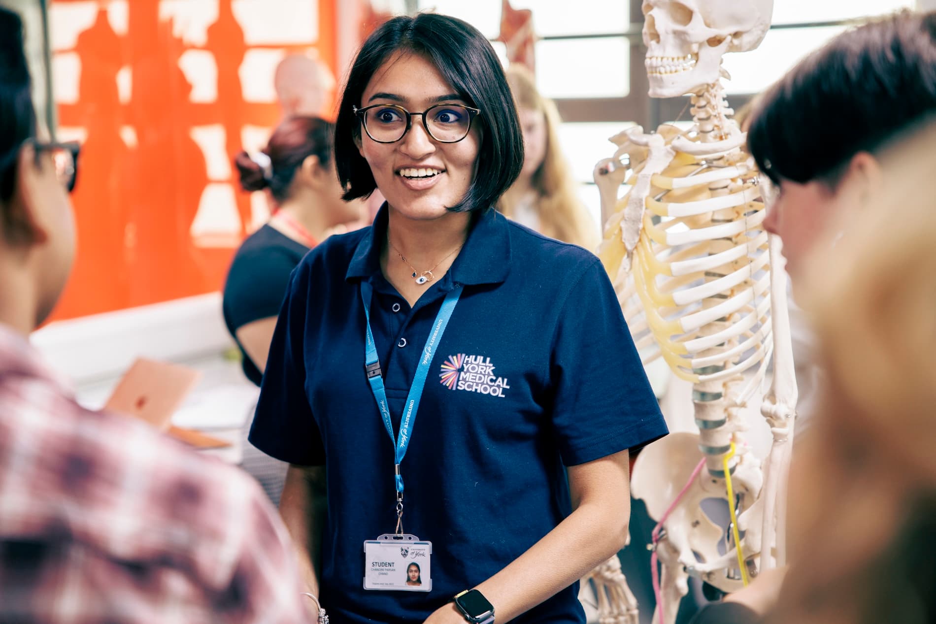 A member of Hull York Medical School staff chatting to students during an anatomy session