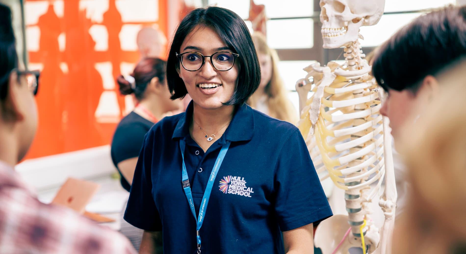 A member of Hull York Medical School staff chatting to students during an anatomy session